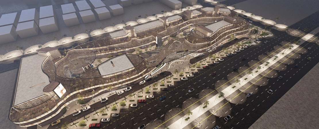 Central pedestrian promenade at Riyadh Icon surrounded by retail and dining spaces with modern landscape design