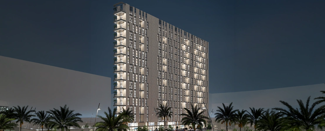 Al Rajhi Tower illuminated at night showcasing structured grid and facade lighting