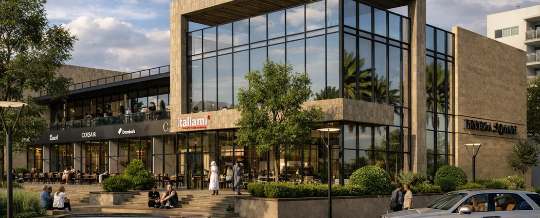 Contemporary retail facades with large glass storefronts at Breeza Square