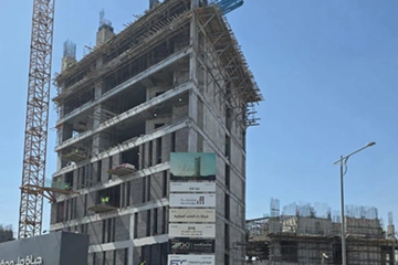 Urban skyline view of BURJ QARAR commercial tower integrated within Riyadh’s modern business district